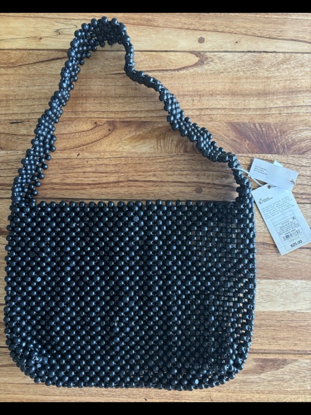 black wooden beaded shoulder bag from the brand A New Day